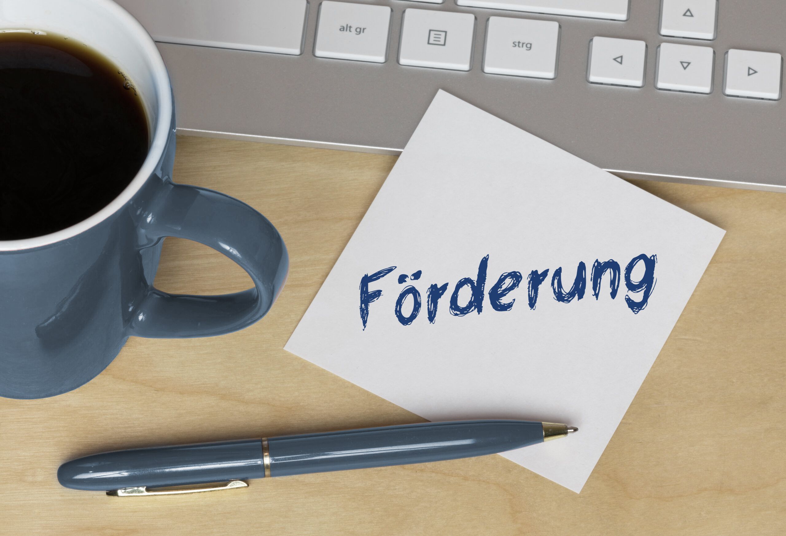 Tasse Kaffee mit Infozettel Förderung